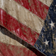 Just as floodwaters brought down this flag in Sanford, Michigan, Donald Trump will bring down the nation’s infrastructure with his deregulatory agenda.